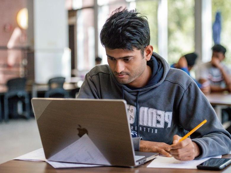 student with laptop at Penn State Abington (near Philadelphia)